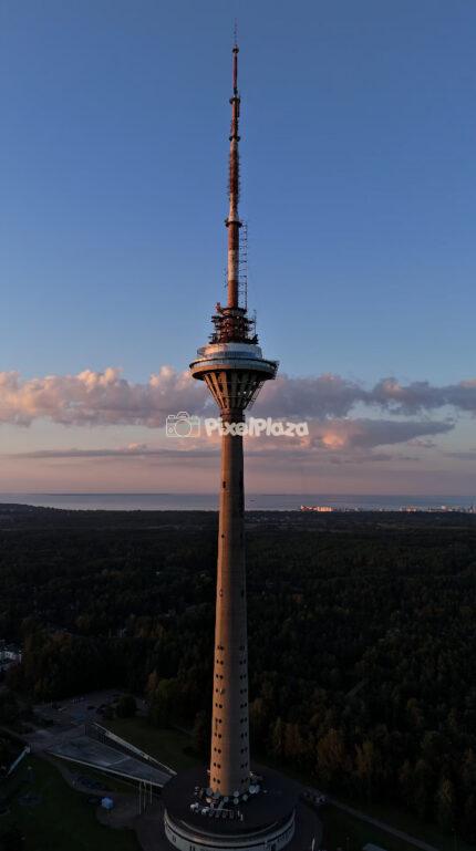 Sunset Aerial Drone View of Tallinn TV Tower - Estonia Landmark with Baltic Sea Horizon - 4K Drone Video
